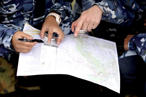 Cadets holding map for navigation