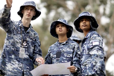 Cadets taking bearing and plotting path