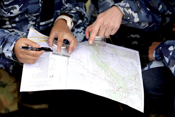 Cadets holding map for navigation